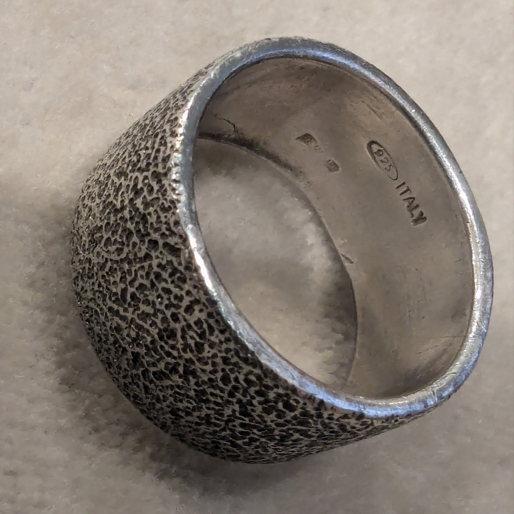 Hammered sterling silver ring handcrafted in Italy. Size 6, 10 mm wide 7 grams